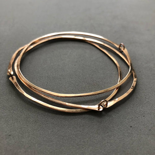 Pebble bangles by Red Door Metalworks