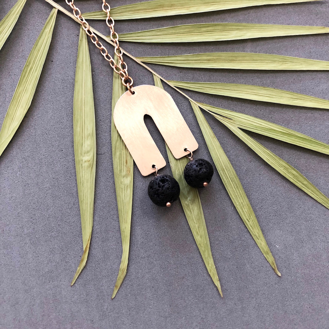Bronze arch with black lava bead dangles necklace by Red Door Metalworks 